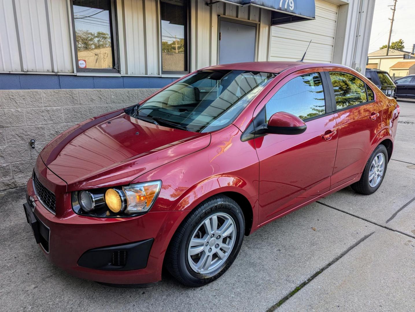 2012 Crystal Red Metallic /Jet Black and Grey Chevrolet Sonic 2LS Sedan (1G1JA5SH1C4) with an 1.8L L4 DOHC 24V FFV engine, 6-Speed Automatic transmission, located at 603 Amelia Street, Plymouth, MI, 48170, (734) 459-5520, 42.378841, -83.464546 - Vehicles shown by appointment - Please call ahead - 734-459-5520, text 734-658-4573 or contact us via our web site at: http://www.selectmotors.com for complete Inventory, Photos, Videos and FREE Carfax Reports. 2012 Chevrolet Sonic LS, Crystal Red Metallic, Black/Grey interior, 139K miles, one - Photo#0