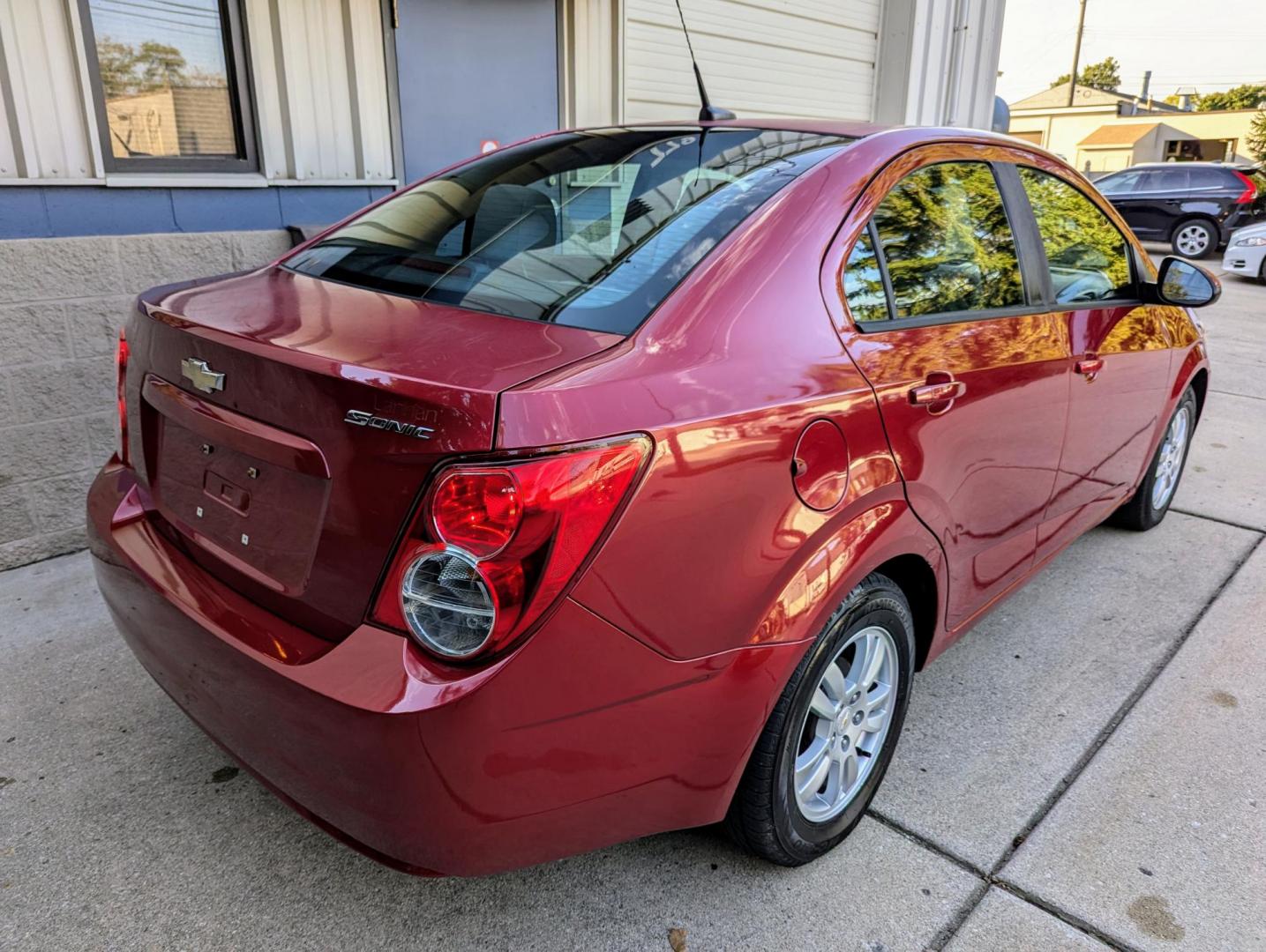 2012 Crystal Red Metallic /Jet Black and Grey Chevrolet Sonic 2LS Sedan (1G1JA5SH1C4) with an 1.8L L4 DOHC 24V FFV engine, 6-Speed Automatic transmission, located at 603 Amelia Street, Plymouth, MI, 48170, (734) 459-5520, 42.378841, -83.464546 - Vehicles shown by appointment - Please call ahead - 734-459-5520, text 734-658-4573 or contact us via our web site at: http://www.selectmotors.com for complete Inventory, Photos, Videos and FREE Carfax Reports. 2012 Chevrolet Sonic LS, Crystal Red Metallic, Black/Grey interior, 139K miles, one - Photo#6