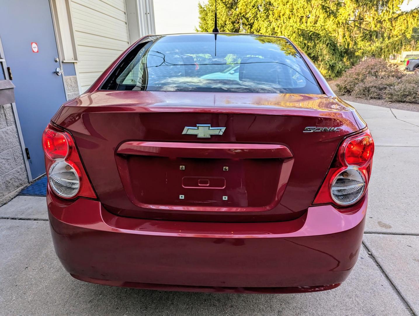 2012 Crystal Red Metallic /Jet Black and Grey Chevrolet Sonic 2LS Sedan (1G1JA5SH1C4) with an 1.8L L4 DOHC 24V FFV engine, 6-Speed Automatic transmission, located at 603 Amelia Street, Plymouth, MI, 48170, (734) 459-5520, 42.378841, -83.464546 - Vehicles shown by appointment - Please call ahead - 734-459-5520, text 734-658-4573 or contact us via our web site at: http://www.selectmotors.com for complete Inventory, Photos, Videos and FREE Carfax Reports. 2012 Chevrolet Sonic LS, Crystal Red Metallic, Black/Grey interior, 139K miles, one - Photo#7