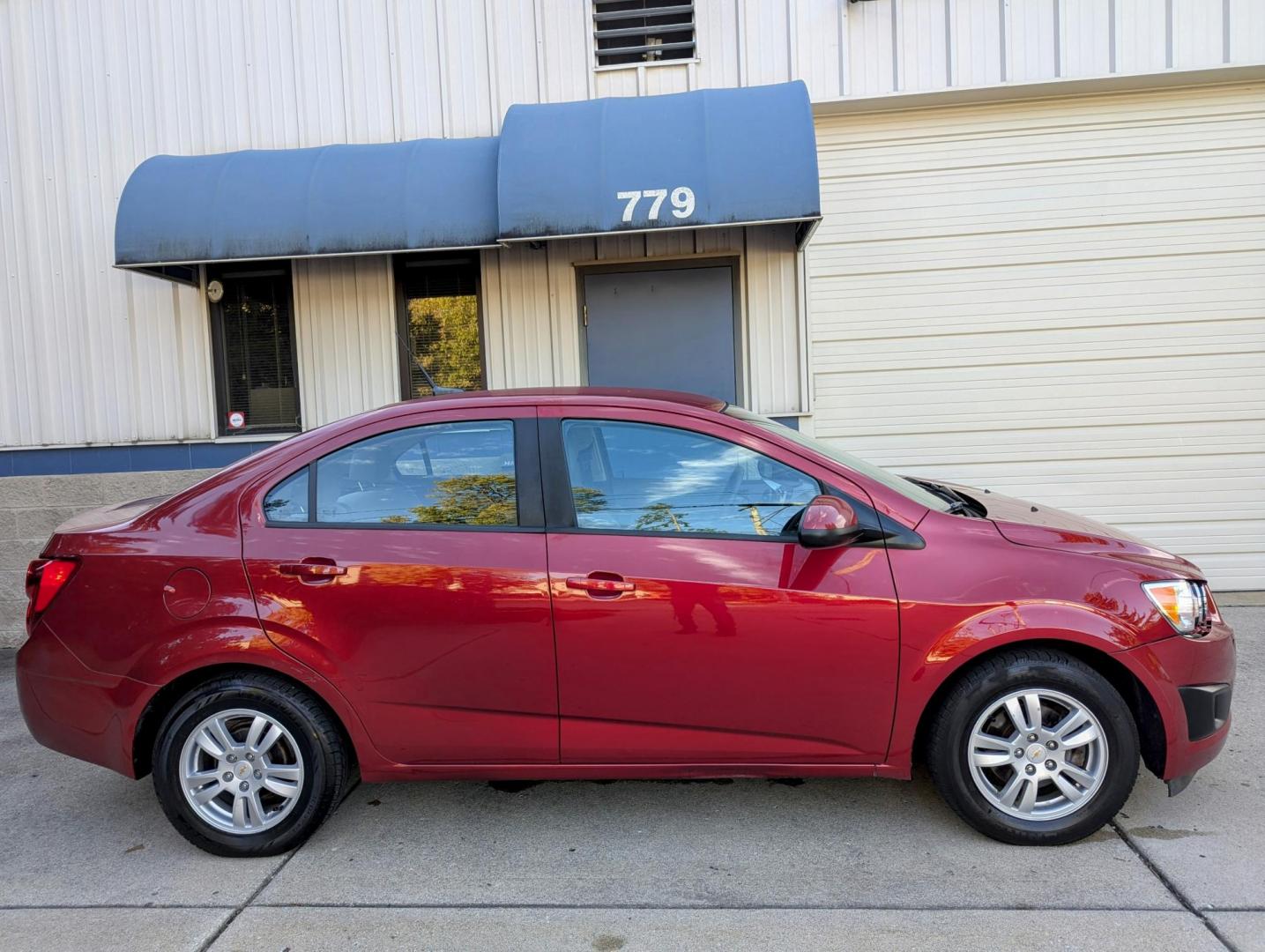 2012 Crystal Red Metallic /Jet Black and Grey Chevrolet Sonic 2LS Sedan (1G1JA5SH1C4) with an 1.8L L4 DOHC 24V FFV engine, 6-Speed Automatic transmission, located at 603 Amelia Street, Plymouth, MI, 48170, (734) 459-5520, 42.378841, -83.464546 - Vehicles shown by appointment - Please call ahead - 734-459-5520, text 734-658-4573 or contact us via our web site at: http://www.selectmotors.com for complete Inventory, Photos, Videos and FREE Carfax Reports. 2012 Chevrolet Sonic LS, Crystal Red Metallic, Black/Grey interior, 139K miles, one - Photo#8